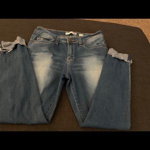 Mid rise distressed jeans with rips